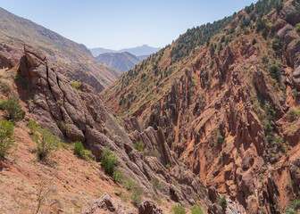 Scenic landscape view of spectacular orange red rocky valley between Shurobod pass and Panj valley, Khatlon, Tajikistan