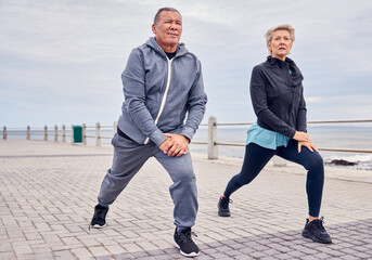 Stretching legs, fitness and senior couple by ocean for exercise, healthy body and wellness in retirement. Sports, pilates and elderly man and woman ready for warm up, cardio workout and training