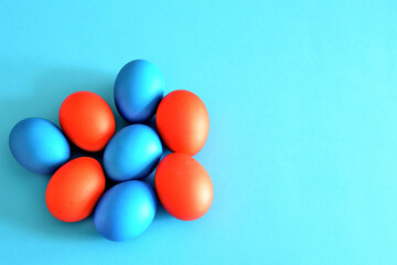 A blue background with red and blue easter eggs on it