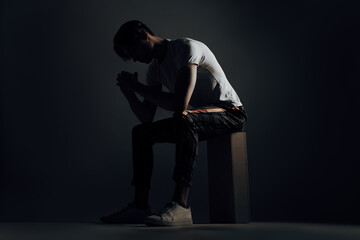 depressed and worried man feel the stigma about his depression and anxiousness caused by trauma,...