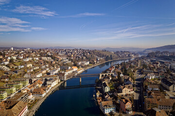 Obraz premium Aerial view of City of Schaffhausen with Rhine River and village of Feuerthalen on a blue cloudy winter day. Photo taken February 16th, 2023, Schaffhausen, Switzerland.