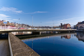 Scenic view of Rhine River at Swiss City of Schaffhausen with car bridge on a sunny winter day. Photo taken February 16th, 2023, Schaffhausen, Switzerland.