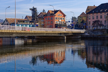 Scenic view of Rhine River at Swiss City of Schaffhausen with car bridge on a sunny winter day. Photo taken February 16th, 2023, Schaffhausen, Switzerland.