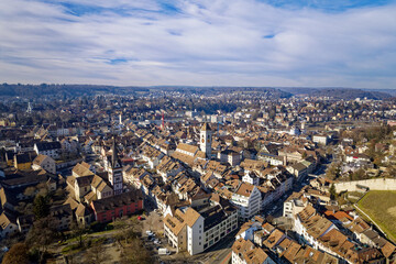 Fototapeta na wymiar Aerial view of City of Schaffhausen with the old town in the foreground on a blue cloudy winter day. Photo taken February 16th, 2023, Schaffhausen, Switzerland.