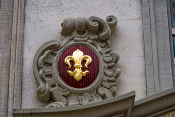 Beautiful facade of historic house with golden lily ornament at the old town of Swiss City of Schaffhausen on a foggy winter day. Photo taken February 16th, 2023, Schaffhausen, Switzerland.