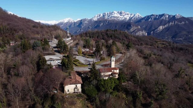Aerial View Over Consonno Ghost Town In The Olginate Municipality Of The Province of Lecco. Pedestal Down, Tilt Up Shot