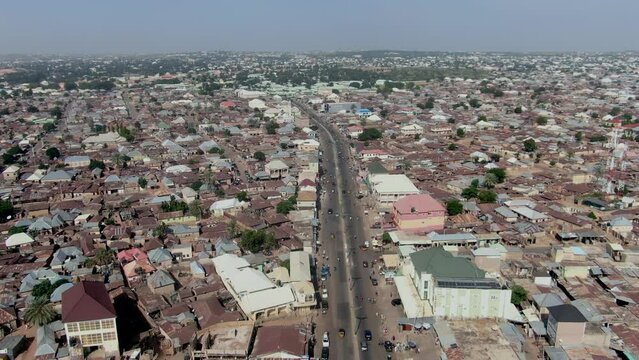 Busy highway in Gombe, Nigeria - descending aerial city view