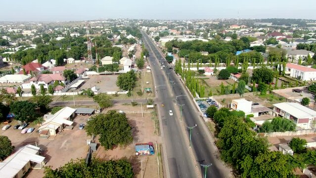 Busy highway in the west African city of Gombe, Nigeria - ascending aerial view
