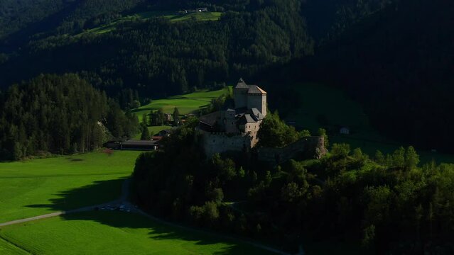 Reifenstein Castle (Castel Tasso) In Freienfeld Near Sterzing, South Tyrol Northern Italy. aerial arc shot