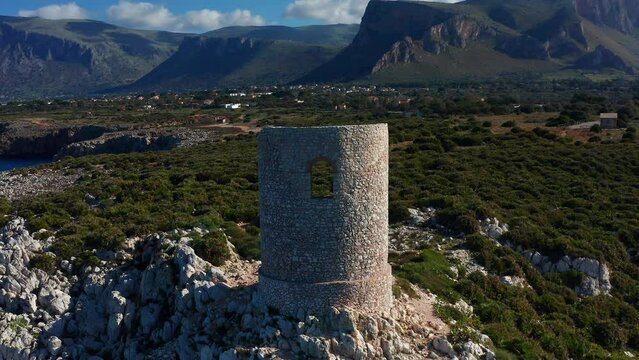 Torre Di Capo Rama, Coastal Defense Tower In Terrasini, Sicily, Italy. - aerial pullback