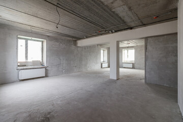 Spacious empty rooms floor after filling out the work on the wall and ceiling