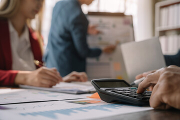 Obraz premium business people discussing on performance revenue in meeting. businessman working with co-worker team. financial adviser analysing data with investor.