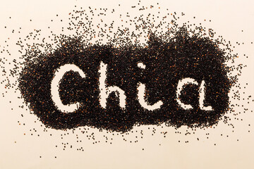 chia word made from chia seeds top view on colored background. Healthy superfood