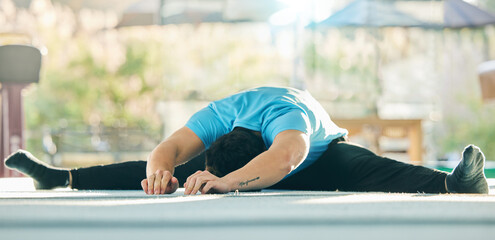 Gymnast stretching, man in gym with fitness and flexibility, professional athlete with gymnastics...