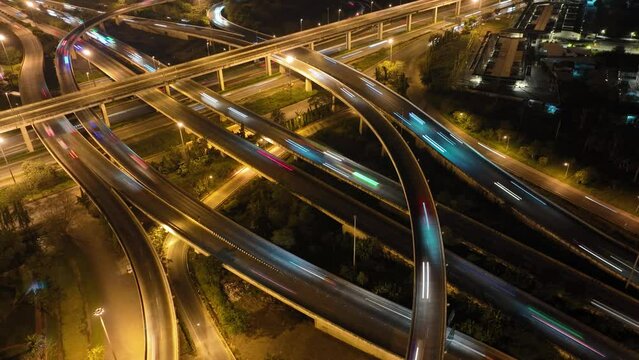 car traffic transportation above circle roundabout road in Asian city. Drone aerial view fly in circle, high angle. Public transport or commuter city life concept	