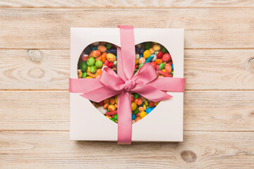 Box with sweet chocolate candies on color background, Various candy sweets. Valentines day gift box. Top view flat lay with copy space