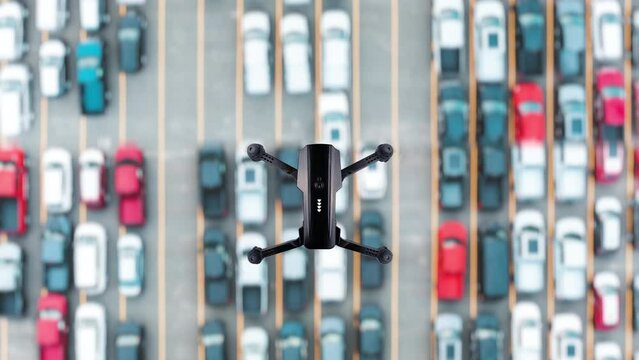 Quadcopter flying over cars. Flying a drone over a highway with vehicles. Seamless loop