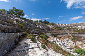 Fototapeta na wymiar Scenic panorama of ancient amphitheatre in antique city of Termessos is one of the main tourist and archaeological site of Turkey.