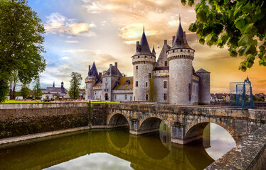great medieval catsles of Loire valley in France. beautiful impressive Sully-sul-Loire over sunset