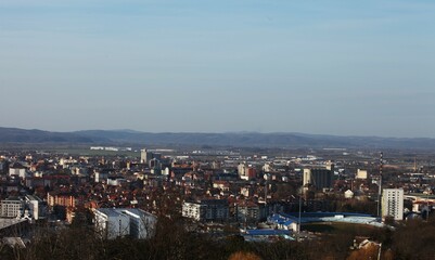 The landscape of the city photographed from the viewpoint, half in the upper part sky blue, in the lower part of the city