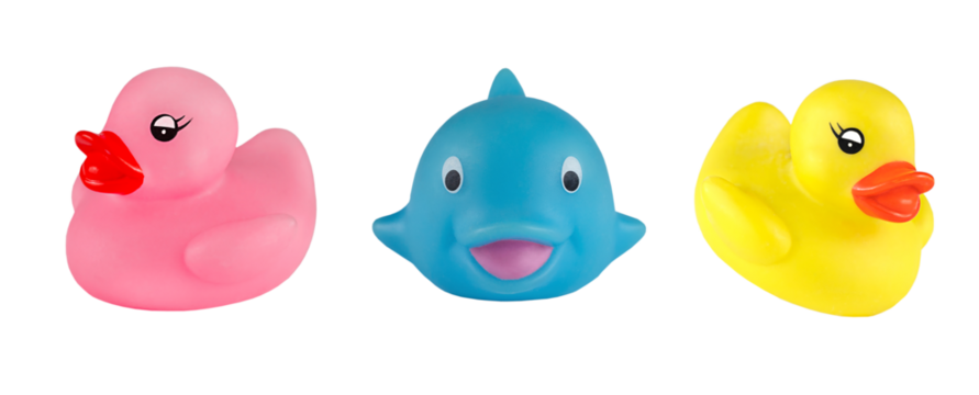 Rubber ducks and blue whale bath toys isolated on white