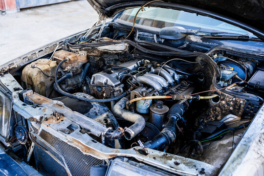Engine of car parked on road