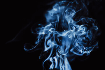 Abstract backdrop with stains of blue incense smoke