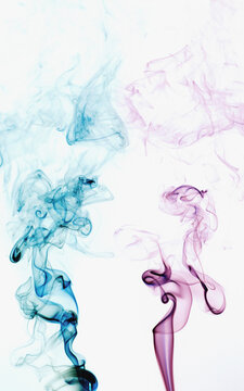 Abstract backdrop with stains of colorful incense smoke