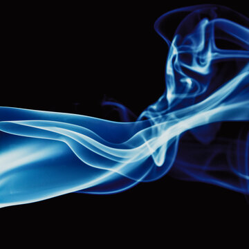 Abstract backdrop with stains of blue incense smoke