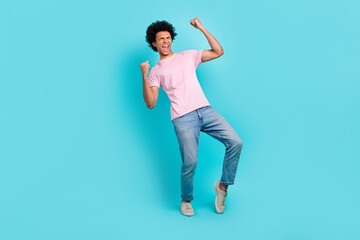 Full body length photo of overjoyed crazy yelling positive guy raise fists up celebrate his project growth isolated on aquamarine color background