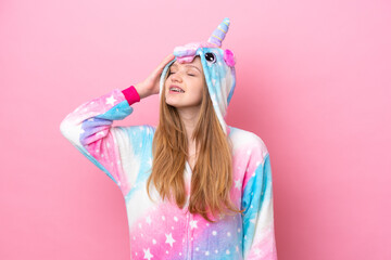 Teenager Russian girl with unicorn pajamas isolated on pink background has realized something and intending the solution