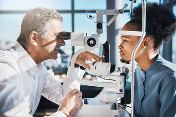 Test, eye exam or black woman consulting doctor for eyesight at optometrist or ophthalmologist....
