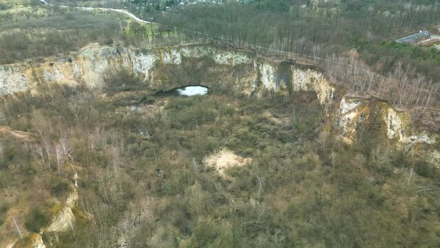 Aerial view of Liban Quarry in Krakow with incredible limestone cliffs, ponds and dense vegetation.