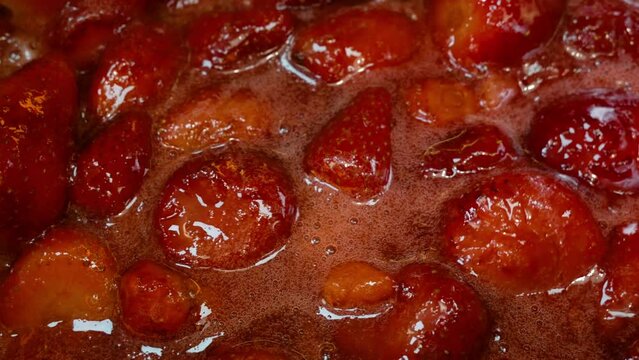 Creating Delicious Strawberry Jam from Whole Fruit Close-Up