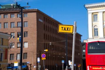 Fototapeta na wymiar closeup taxi sign on city street
