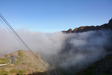Fog  in the mountains with road on Tenerife in Spain