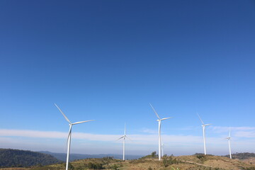 wind turbine in the field windmill on the mountain clear blue sky for electricity green energy for sustainable environment alternatives energy saving 