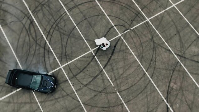 A black car is circling around a girl in a white dress. Cool extreme shots