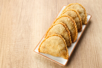Jalangkote, Indonesian traditional snack filled with egg, carrot, potato, rice noodles. Served with chili sauce

