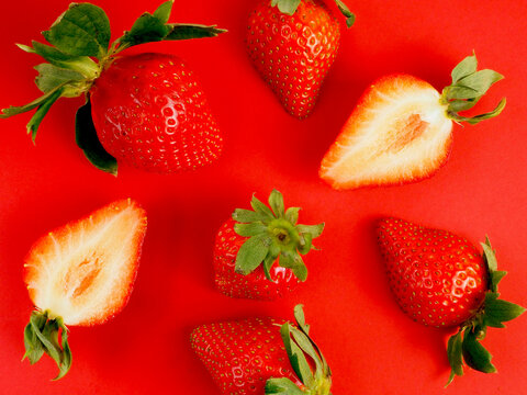 Overhead View Photo Of Whole And Cut Strawberries