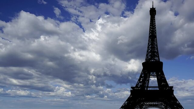  Eiffel Tower in Paris, France (against the background of moving clouds), time lapse