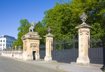 Fototapeta na wymiar Gate with sculpture of a lion of Royal Palace in Brussels, Belgium