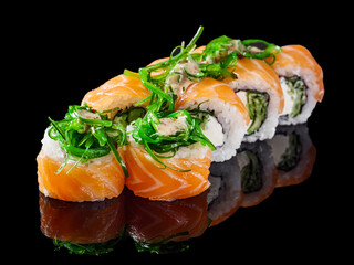sushi roll with cream cheese philadelphia salmon cucumber chukka on a black mirror background