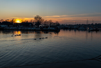 Sunset of a rural English lake.