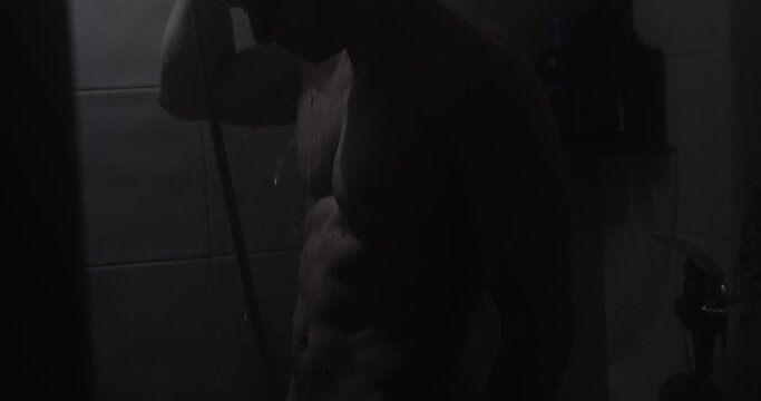 Slow motion sexy naked man take a shower
