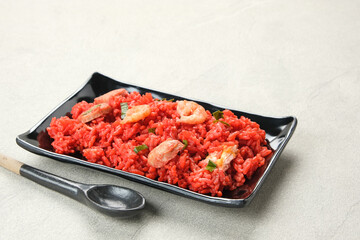 Nasi Goreng Merah, traditional food from Makassar, Indonesia. Fried rice with tomato sauce, shrimp, meatballs and egg.
