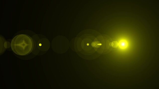 Yellow optical lens flare effect. 4K resolution. Very high quality and realistic.on black background