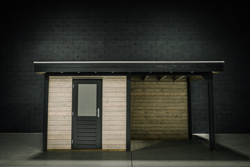 New pinewood shed on factory. black painted storage hut.