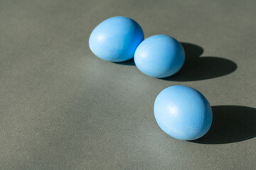 Easter blue eggs on a gray background