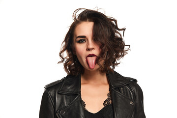 Closeup portrait of young sexy emotional hipster woman in leather jacket expressing vivid emotions over white background.